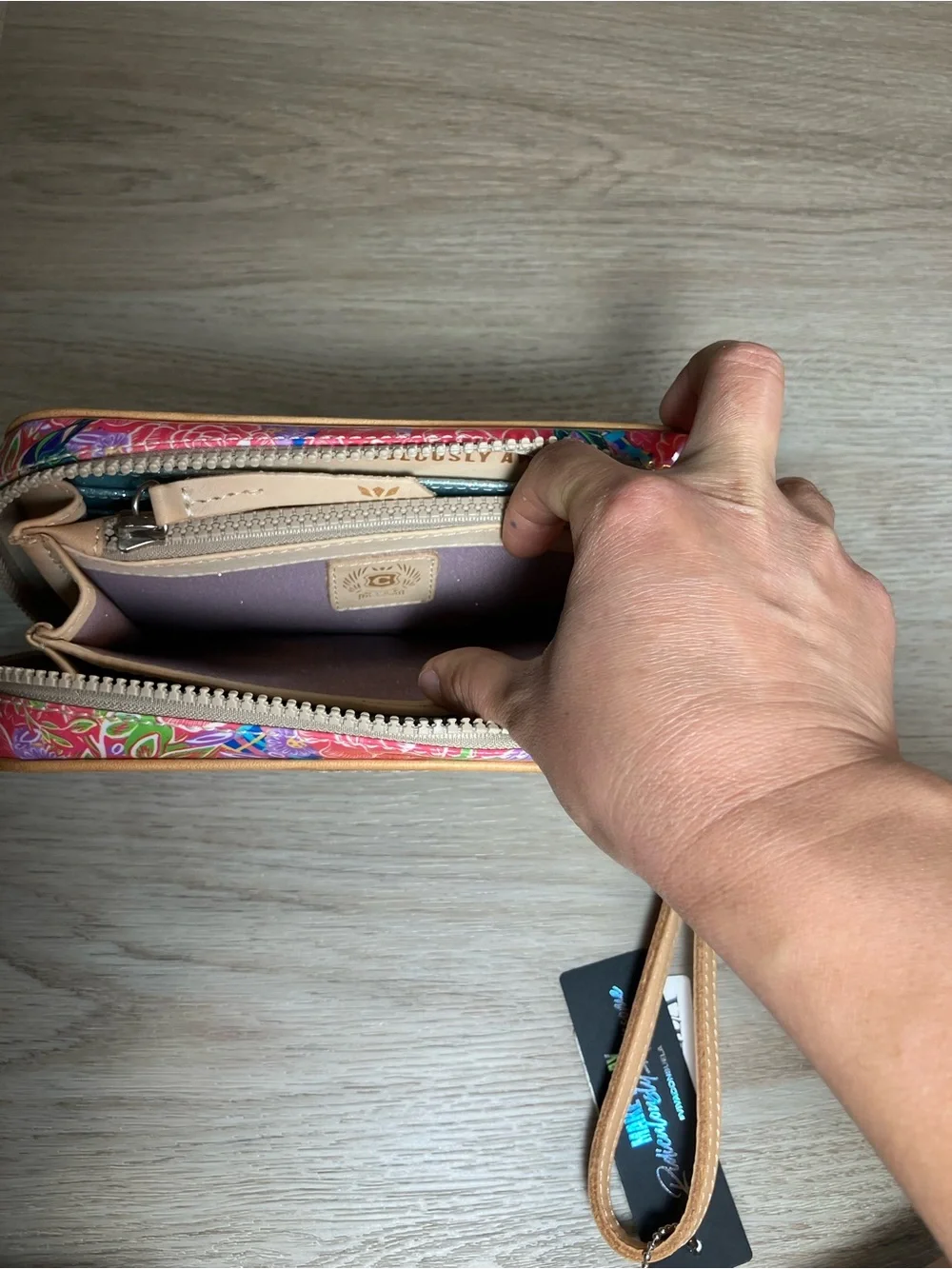 Consuela Pink Floral Embossed Zip Wristlet with Tan Strap